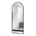 Arched entryway mirror with black metal frame and coat hooks along the bottom