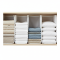 Linen closet shelf dividers keeping folded towels neatly separated