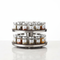 Rotating 2-tier spice rack organizer with spice jars on kitchen countertop