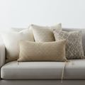 Set of 4 decorative throw pillow covers in neutral tones on a couch