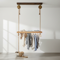 Ceiling-mounted wooden pulley clothing rack hanging from ceiling with rope system