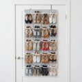 Over-the-door shoe organizer with clear pockets holding multiple pairs of shoes